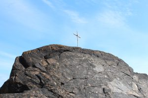 cross on top of rock